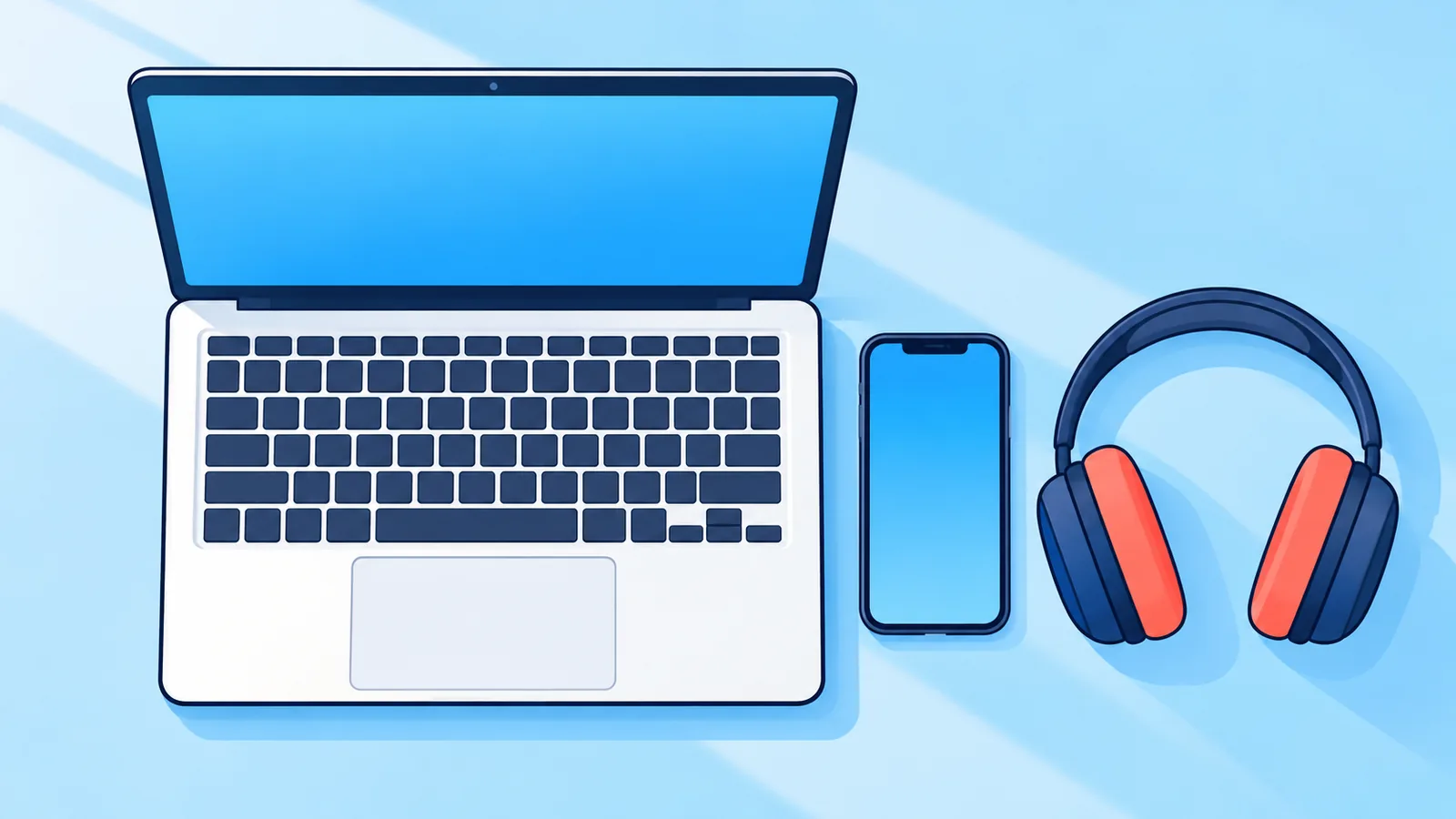 Scrivania ordinata con computer portatile, smartphone e cuffie
