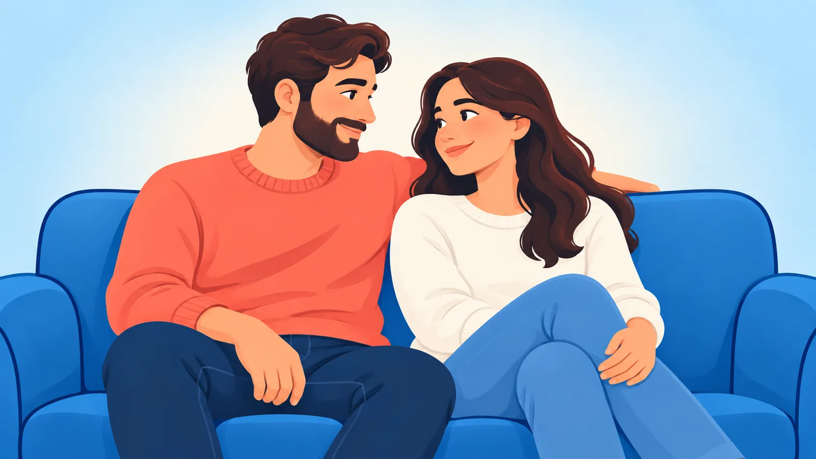 Casal sorrindo e relaxado no sofá da sala